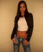 Janessa Brazil in the bathroom stripping.