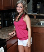 Melissa XoXo shows off her amazing body in the kitchen and fingers herself on the counter.